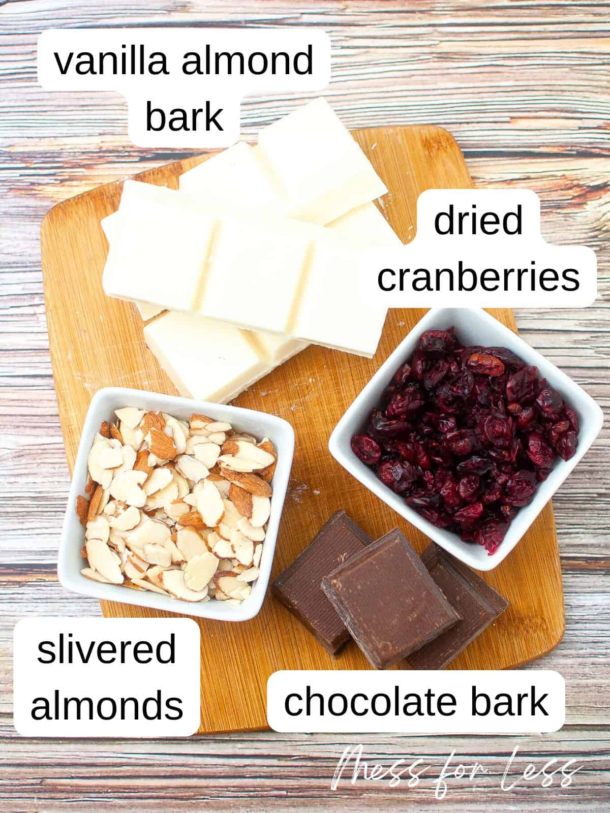 Ingredients for cranberry almond bark recipe on cutting board