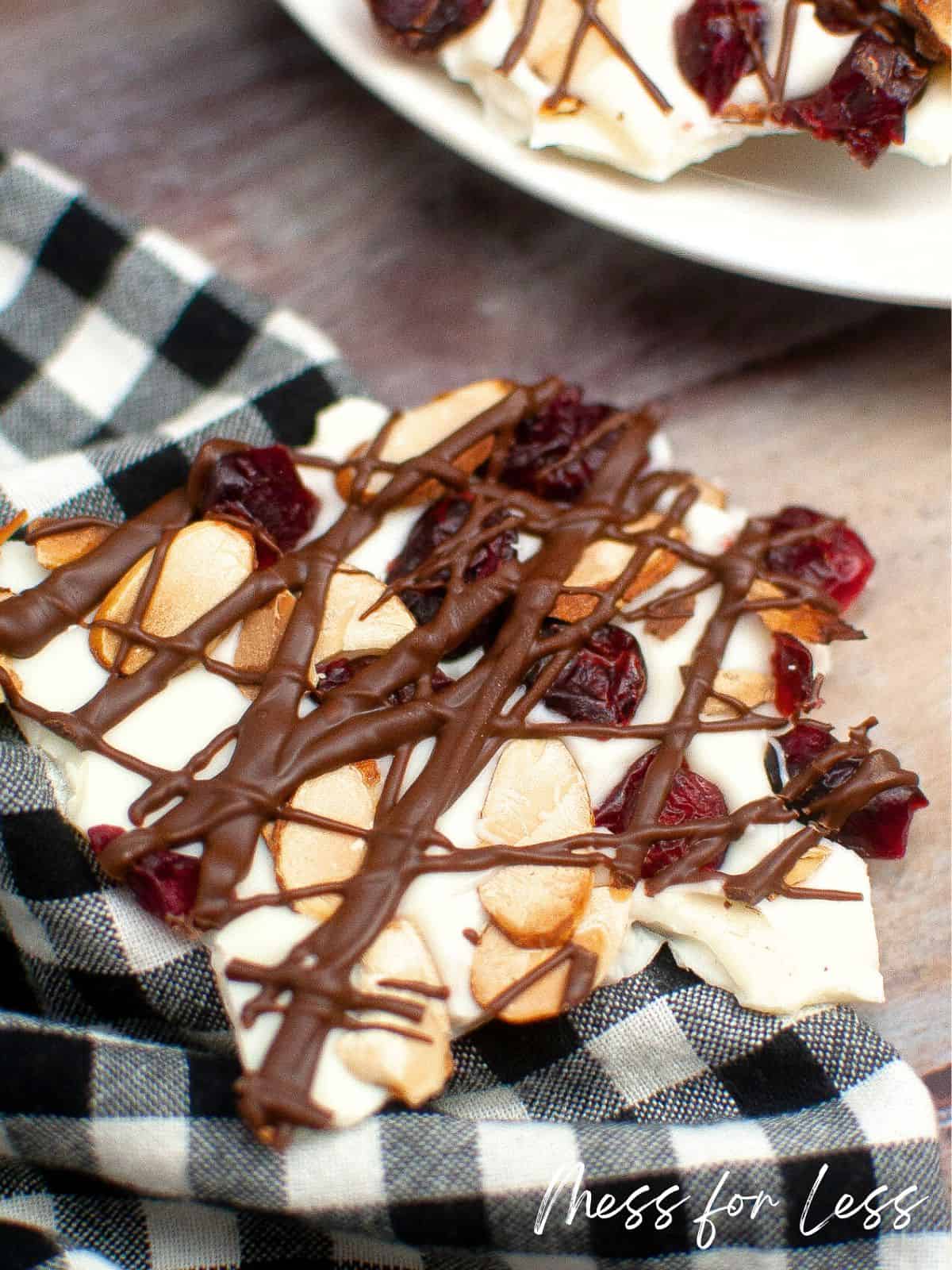 cranberry almond bark with black and white checked napkin