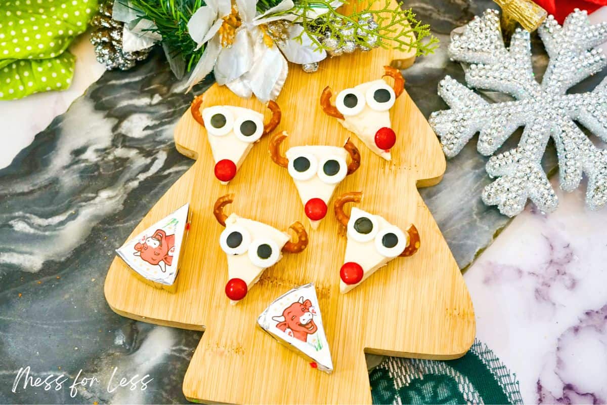 laughing cow cheese rudolph on christmas tree shaped cutting board