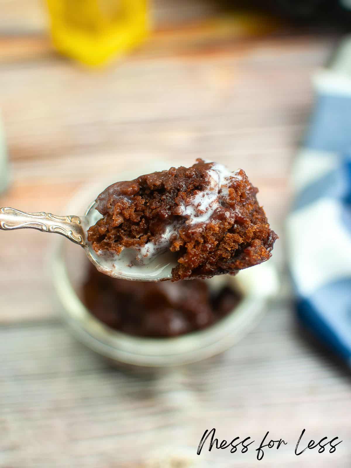 bowl of crockpot lava cake with cake on spoon