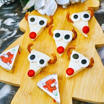 reindeer cheese appetizer on christmas tree shaped cutting board