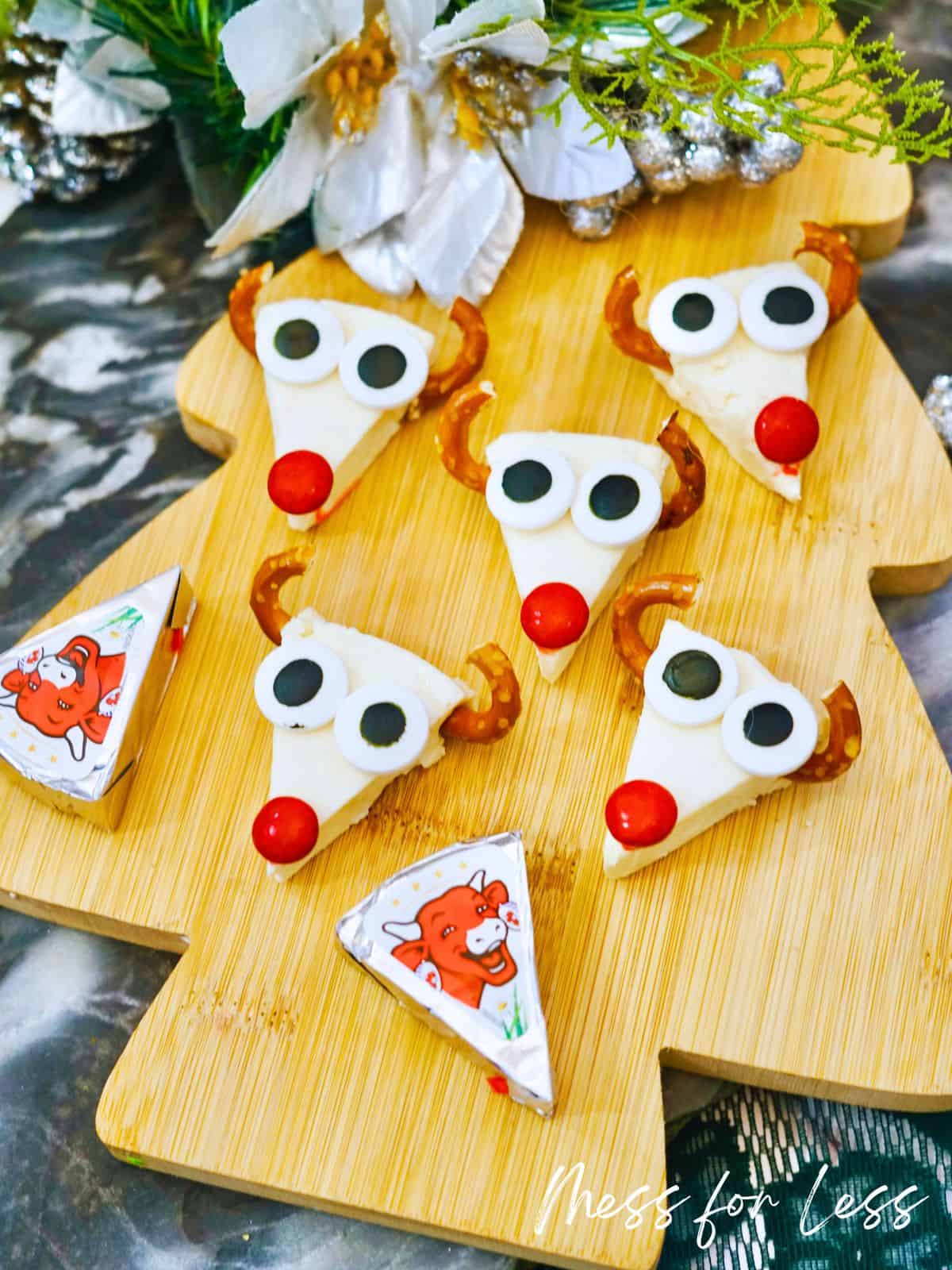 reindeer cheese appetizer on christmas tree shaped cutting board