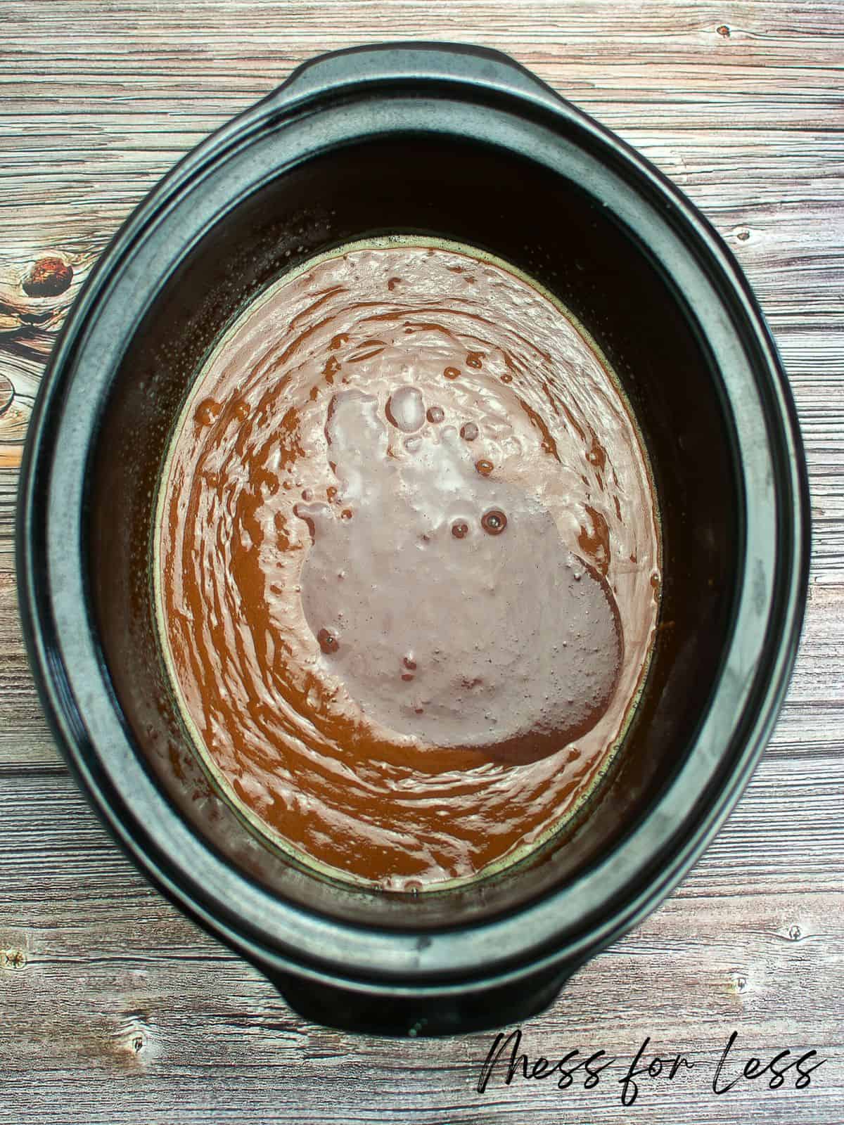 adding chocolate pudding to chocolate cake mix in crock pot