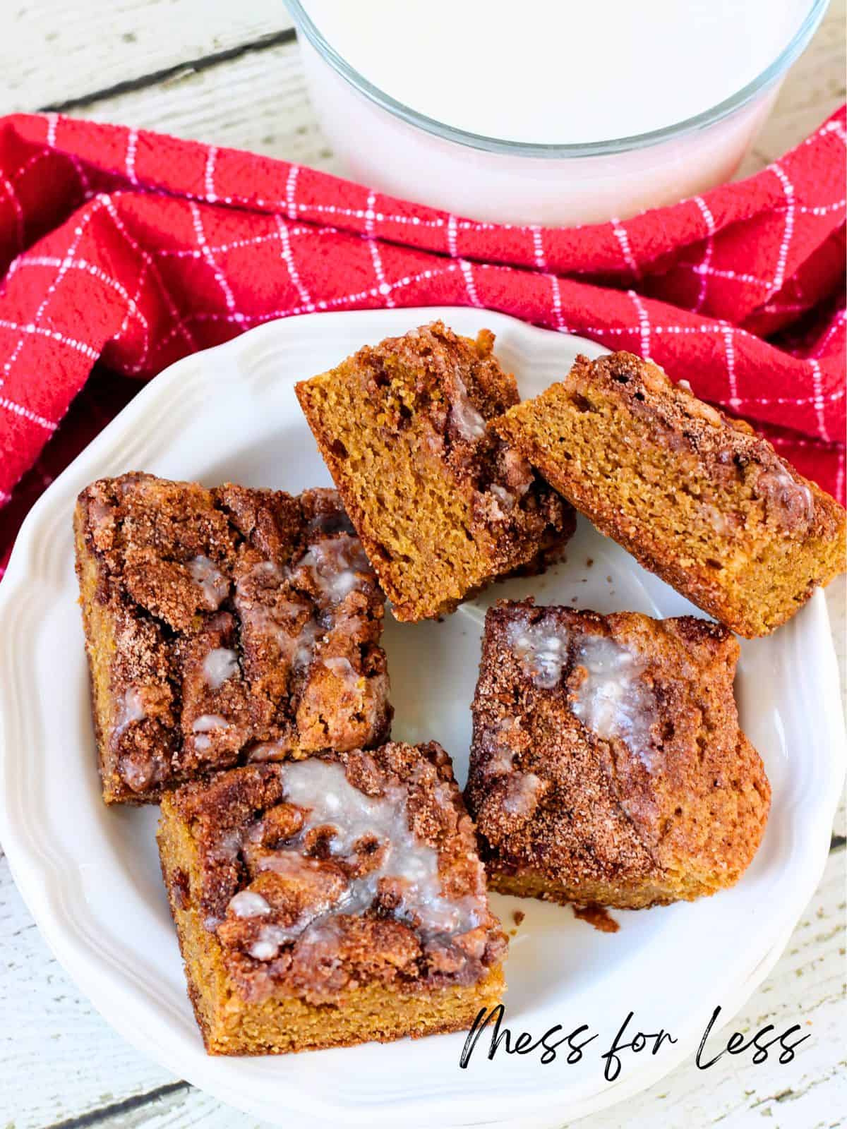blondies on a plate with milk in the background