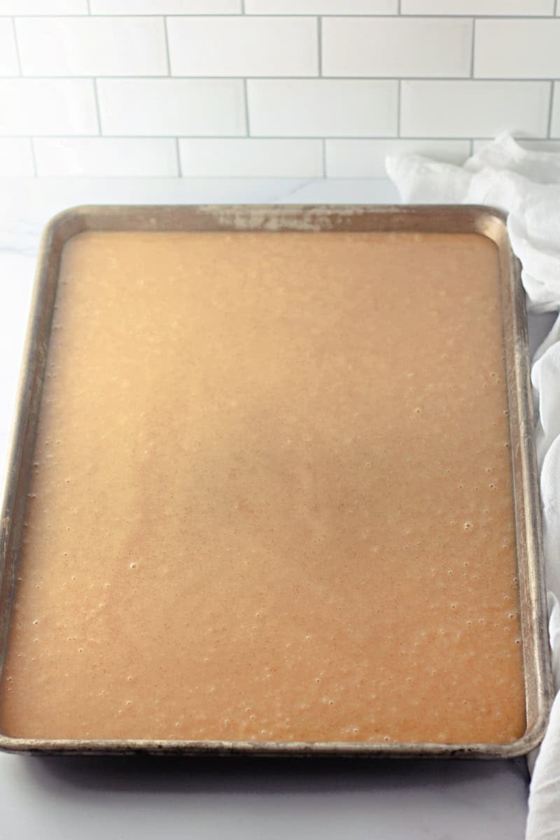 caramel apple cake batter in a pan