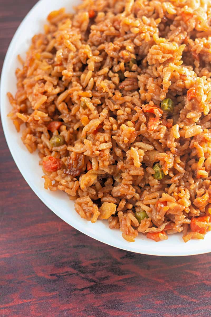 easy fried rice on white plate on dark wood table