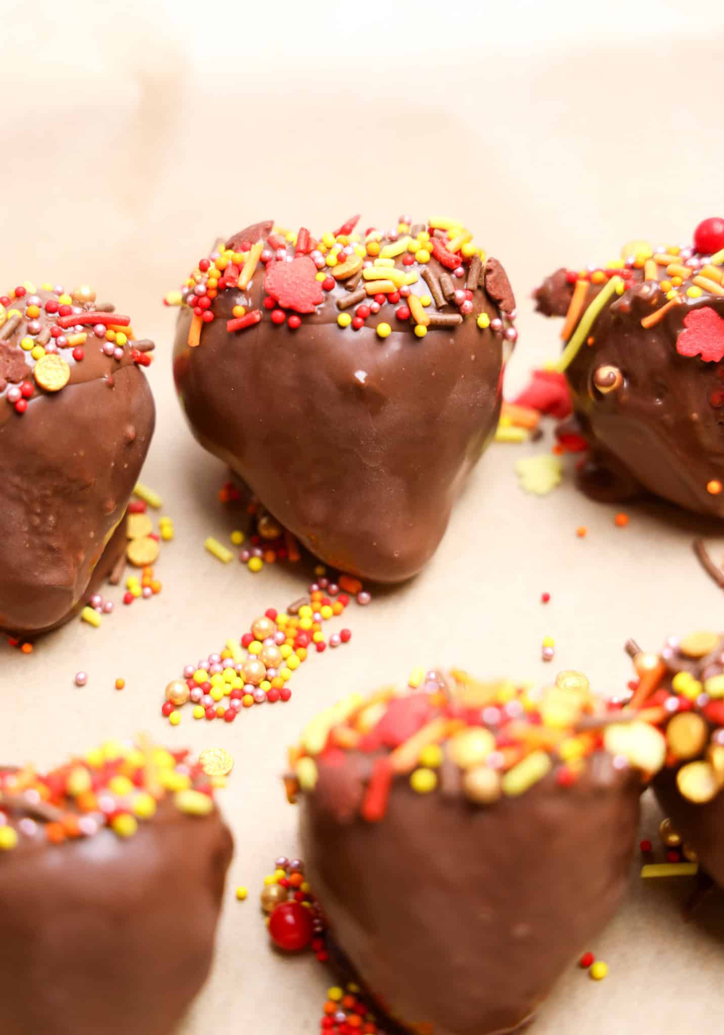 Delicious chocolate-covered strawberries topped with vibrant sprinkles, ideal for birthdays, parties, or holiday treats.