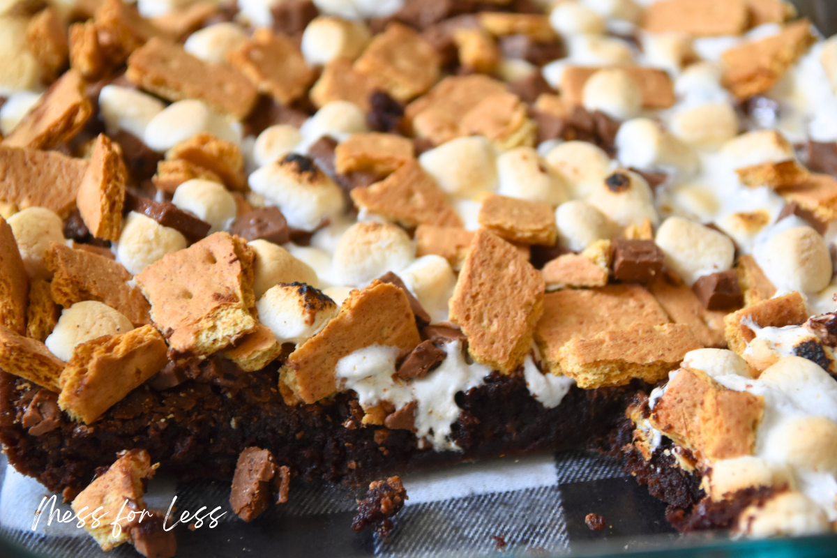 Close-up of s’mores brownies topped with toasted marshmallows, chocolate, and graham cracker pieces—a delicious s’mores brownies recipe made easy with boxed brownie mix.